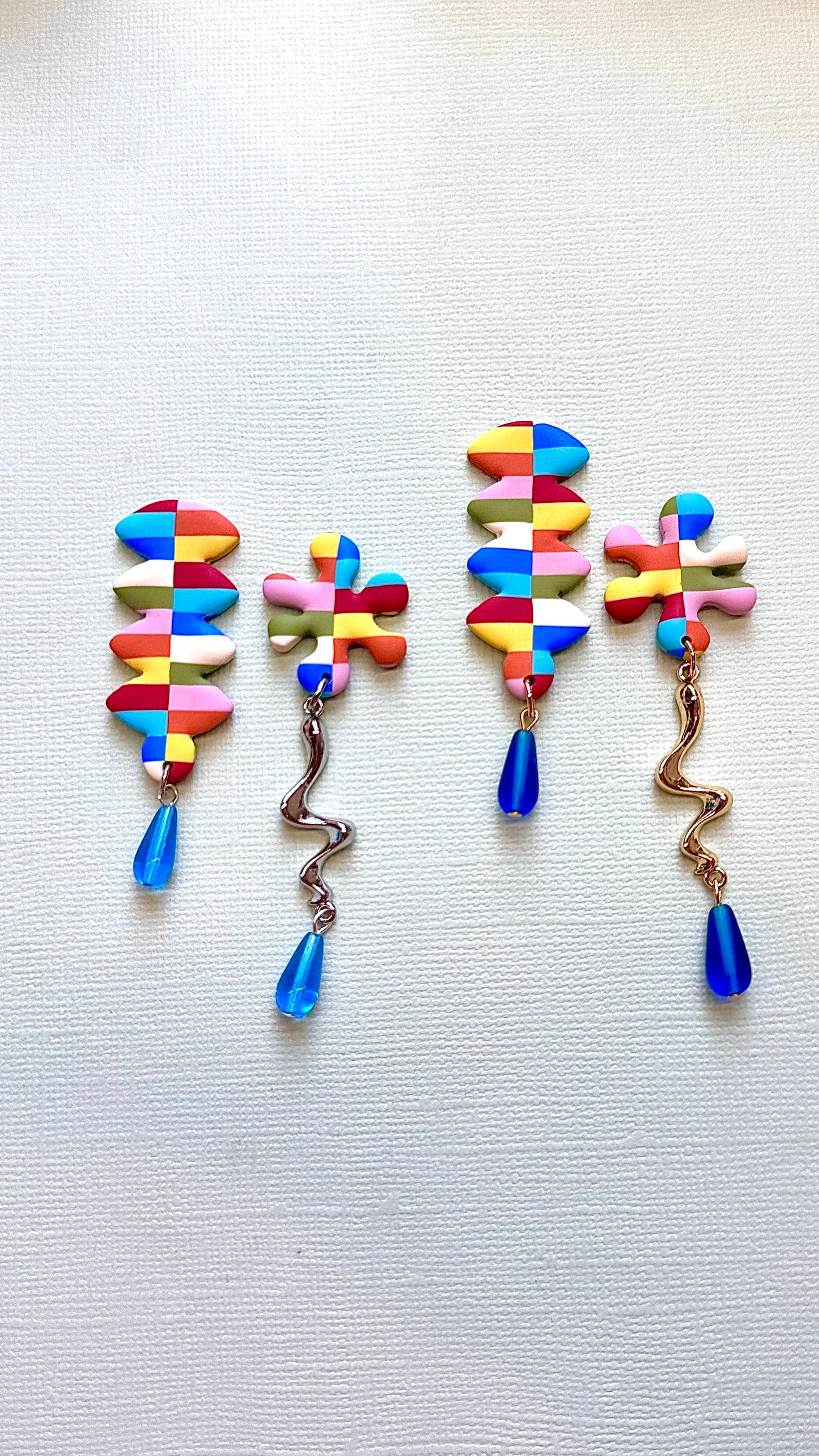 Asymmetrical colorful studs